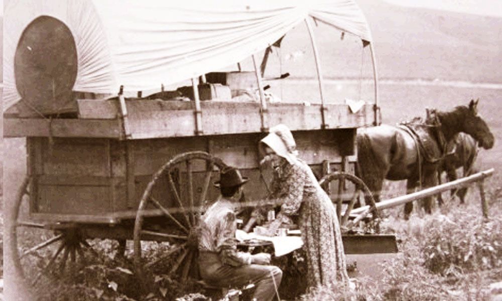 Pioneer Family Eating by the Wagon