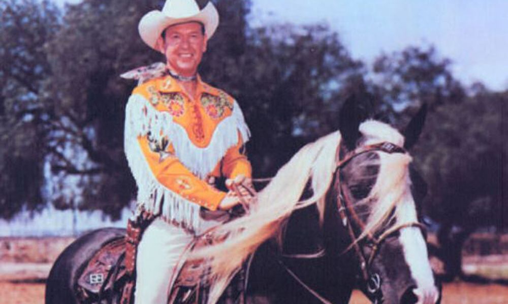 photograph of cowboy Rex Allen dressed in yellow on horse Koko