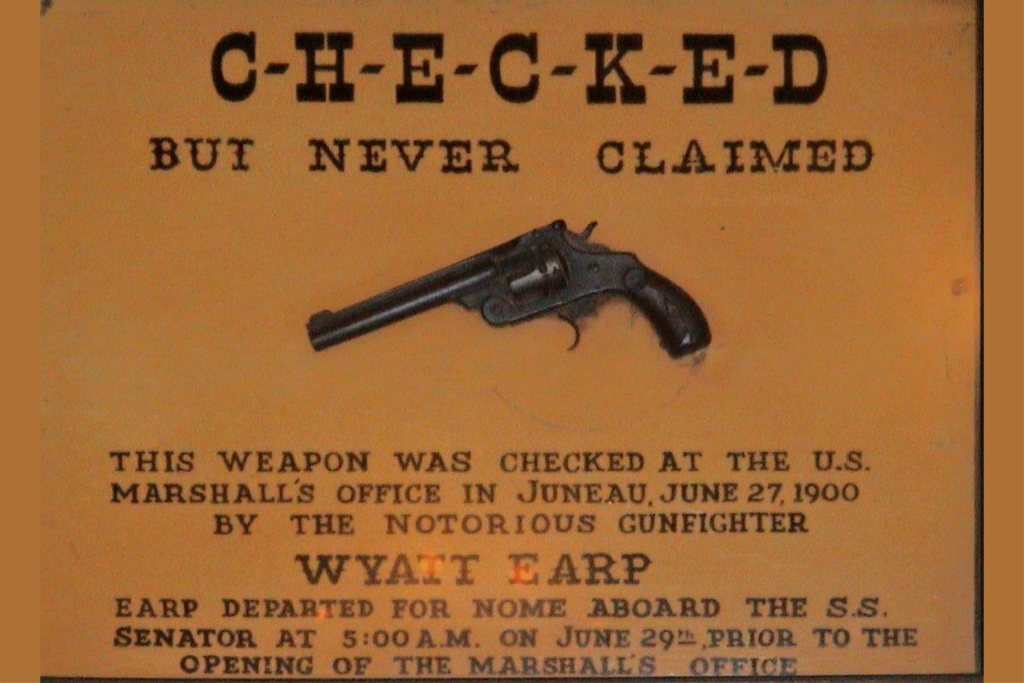 Check Your Guns at the Door Cast Iron Plaque Saloon Wyatt Earp 7 1/4 x 3 1/4” NR 